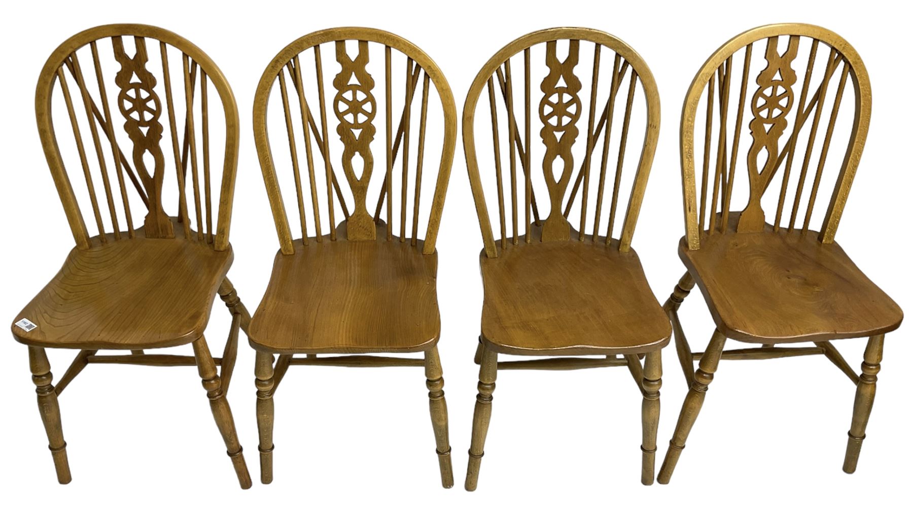 Set of four elm and beech wheelback dining chairs