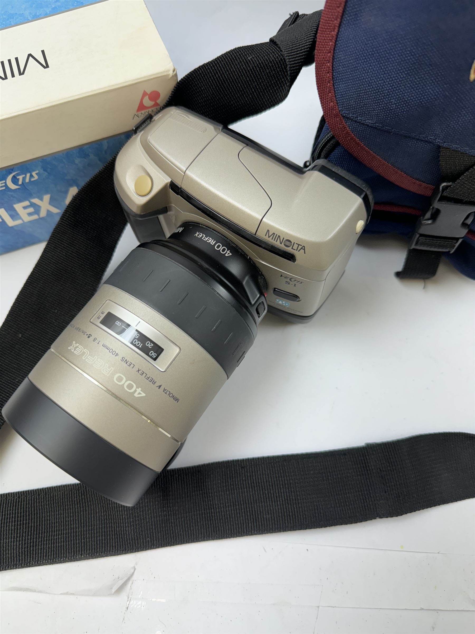 Minolta Vectis S-1 camera body, serial no. 98610281, with a Minolta Vectis V Reflex 400/8 400mm 1:8 lens, lens with box, camera with carry case and battery pack BP-S1