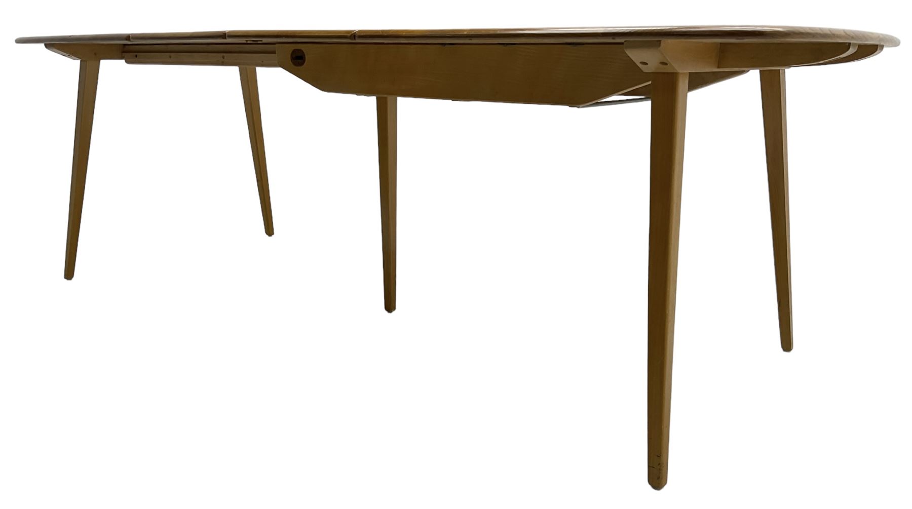 Ercol - light elm and beech 'Slide Leg Expanding Dining Table (444)', rectangular top with rounded corners, raised on tapered splayed supports, with two additional leaves