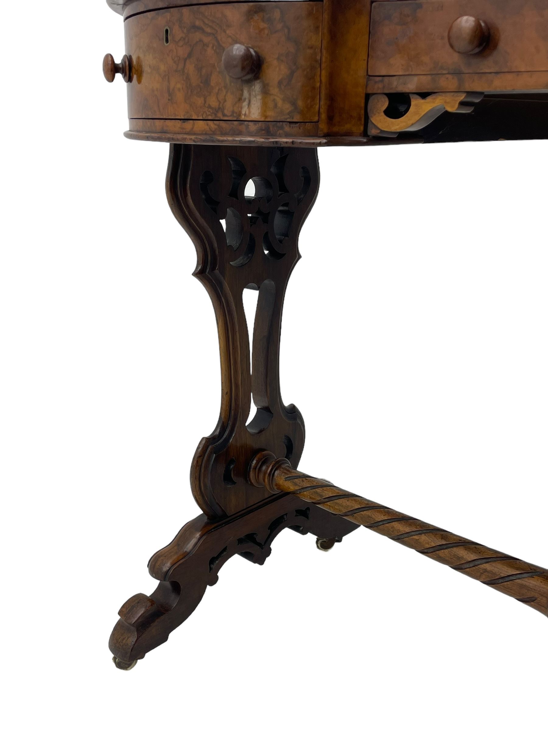 Victorian walnut kidney-shaped writing desk, moulded top with floral cast brass gallery and inset leather writing surface, fitted with three frieze drawers with turned handles, shaped and pierced end supports on raised platforms terminating to splayed feet, united by twist turned and lobe carved stretcher, brass and ceramic castors 