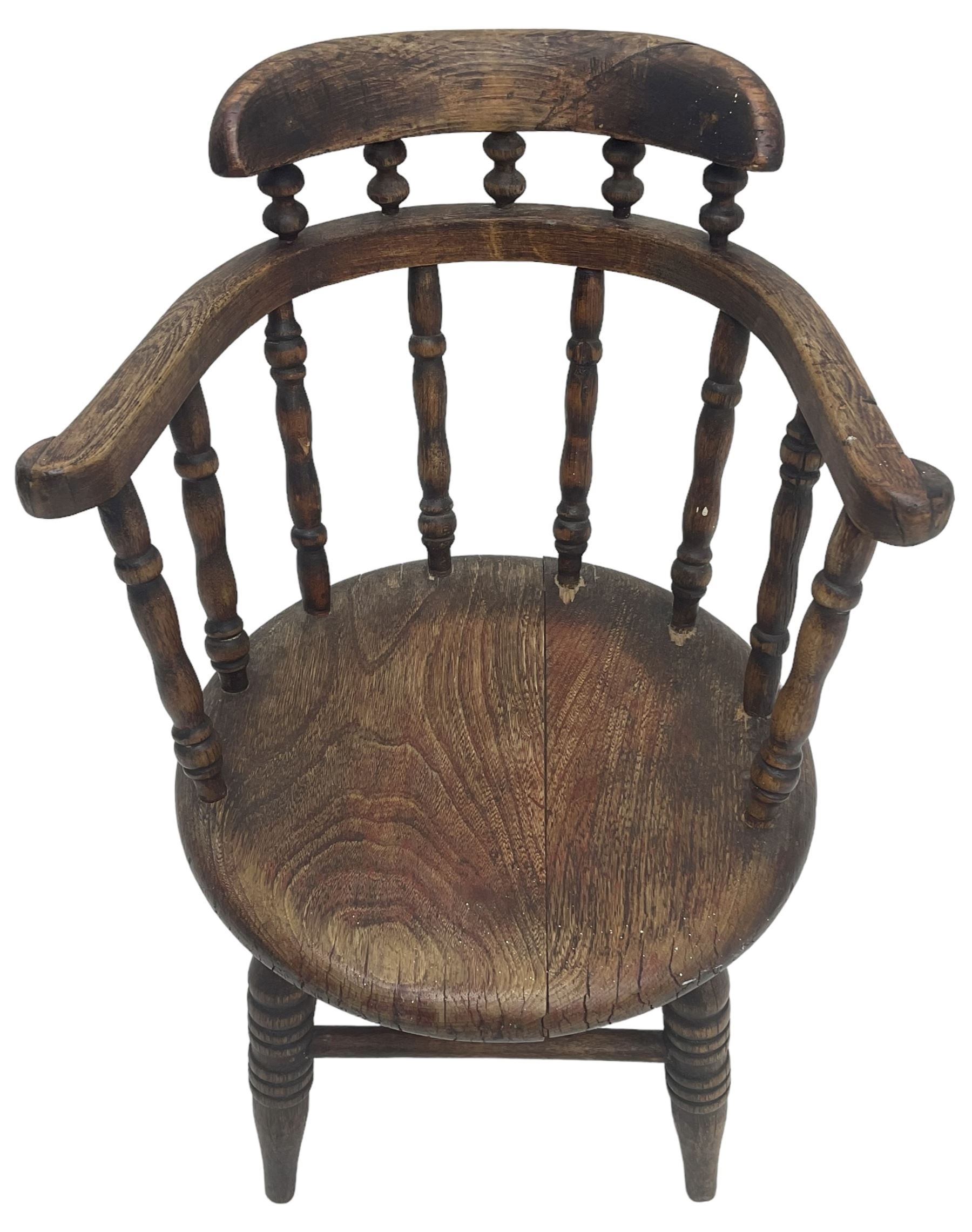 19th century child's spindle back armchair, curved cresting rail over bow arms on spindle supports, circular seat on ring turned supports united by turned stretchers 