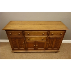  Ercol golden dawn finish sideboard with four drawers and four cupboards, W155cm, H89cm, D52cm  