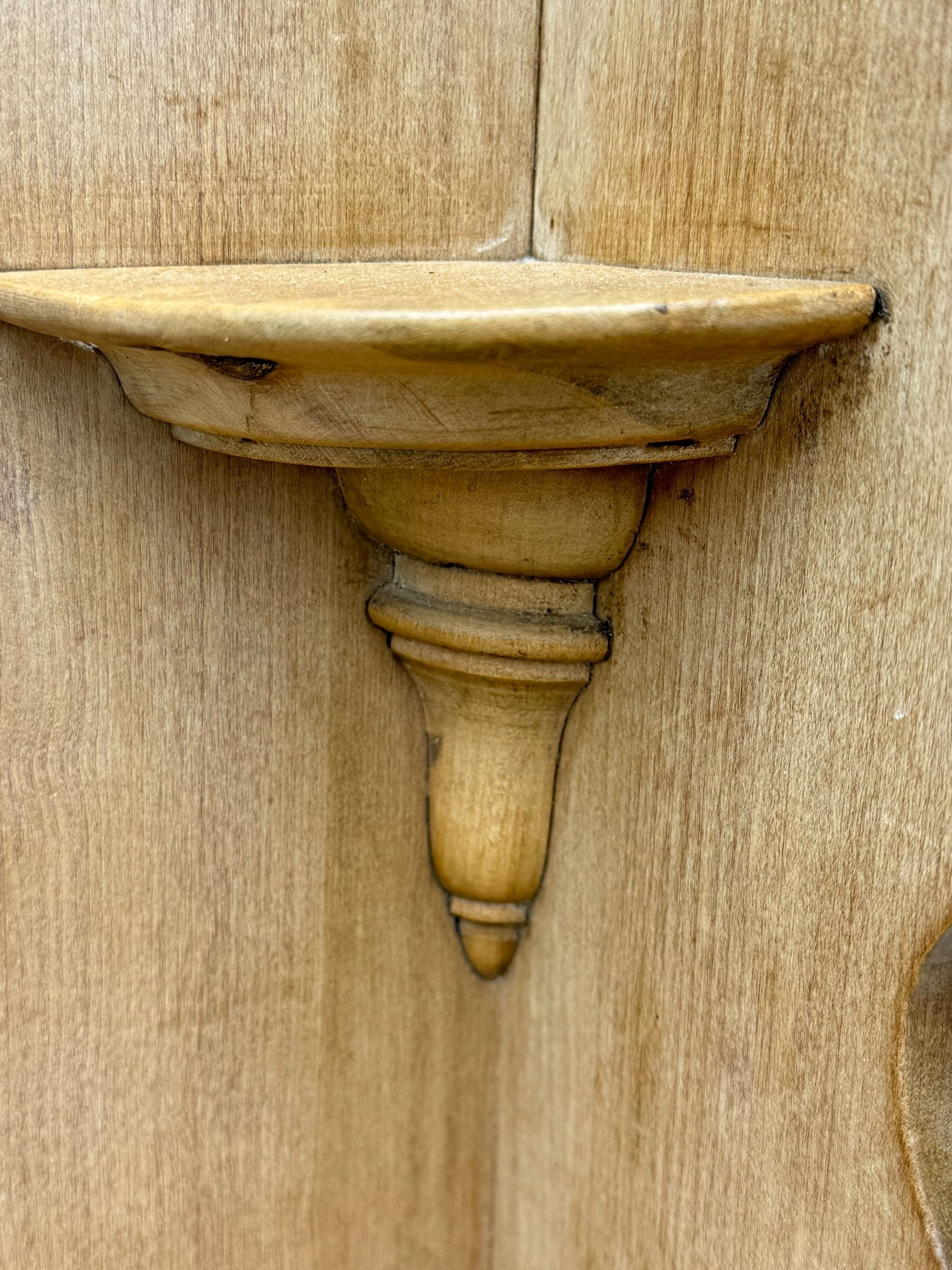 Late Victorian satin walnut dressing table, central mirror with carved crest flanked by two adjustable side mirrors, each supported by turned uprights, the base fitted with two short over two long drawers with brass handles, resting on bracket feet