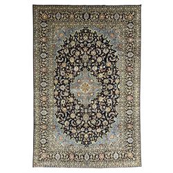 Persian Kashan indigo ground carpet, floral pattern light blue ground central medallion an...