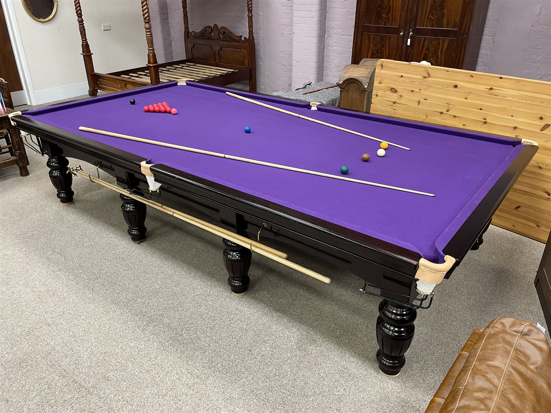 Riley - full-sized 12' x 6' slate bed snooker table, mahogany frame with purple baize, raised on turned and fluted baluster supports, recently refurbished; together with, cues, scoreboard, cover, snooker and pool balls