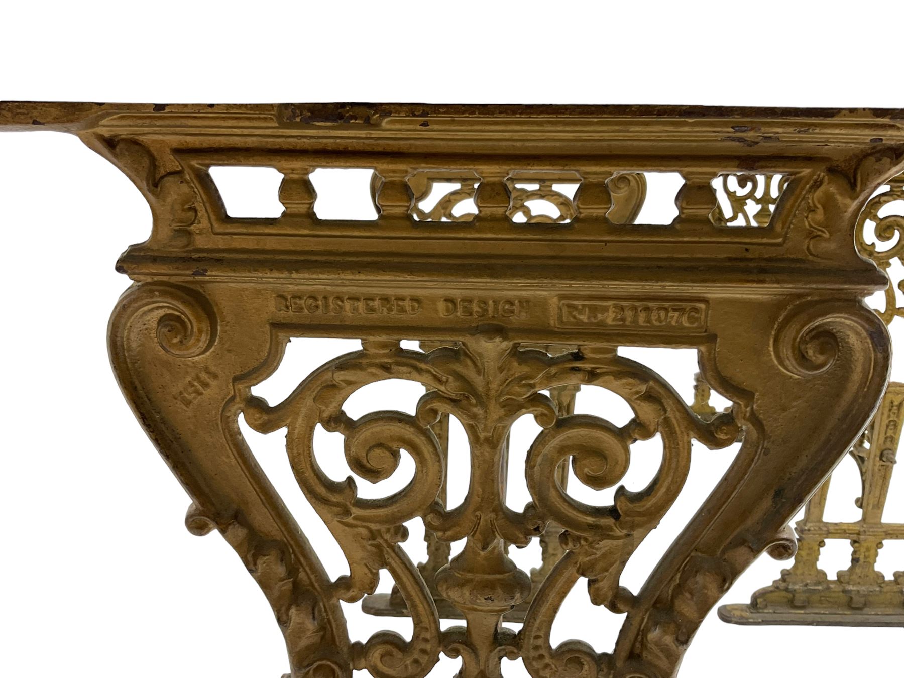 Pair of 19th century cast iron entrance tables, rectangular marble top over ornate gilt bases with scrolling foliate design and sledge feet, united by balustrade stretcher with scroll spandrels