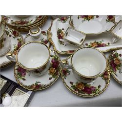 Royal Albert Old Country Roses pattern coffee service for six, comprising coffee pot, milk jug, cups and saucers, cake plate, together with miniature teapot, six teacups and saucers, six dinner plates, six side plates etc 