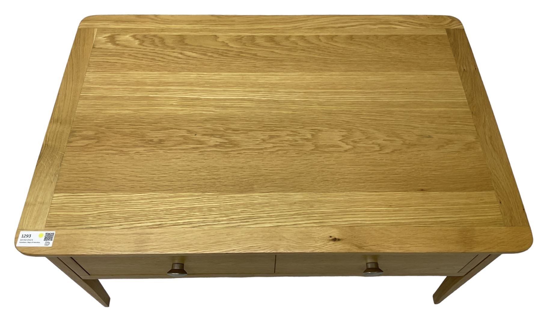 Contemporary light oak rectangular coffee table, fitted with single drawer disguised as two drawers to each side, on tapering supports