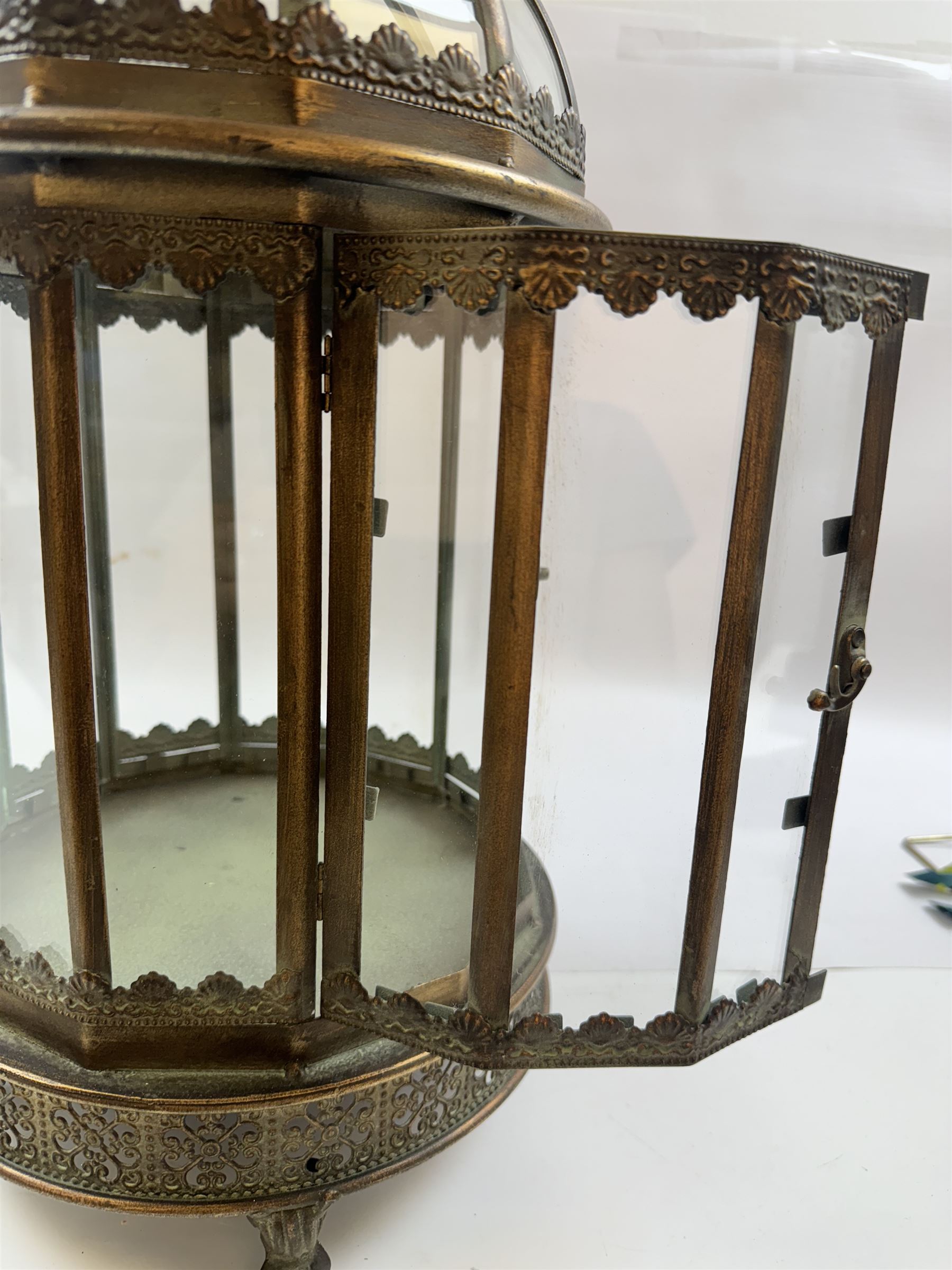 Pair of patinated brushed brass lanterns, of domed hexagonal form, with pierced gallery and swing handle, H63cm 


