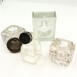 Victorian and later inkwells to include a brass casket form inkwell with hinged cover, a novelty inkwell in the form of a coal bucket with swing handle and leather covered inkwell, various glass examples, together with an early 20th century silver mounted match stick holder/ striker 