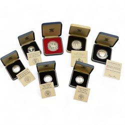 Eight The Royal Mint United Kingdom silver proof coins, comprising 1980 '80th Birthday' crown, 1981 'His Royal Highness The Prince Of Wales And Lady Diana Spencer' crown, 1984, 1985, 1986 and 1987 one pounds, all cased with certificates and a 1977 crown cased no certificate (8)