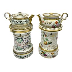 Two 19th century continental teapots and warmers, each teapot upon a cylindrical warming base, hand printed with floral sprigs, birds and insects, largest H22cm 