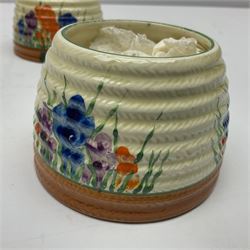 Two Clarice Cliff Bizarre for Newport Pottery, beehive honey pot with cover in Crocus pattern, with printed mark beneath, H9cm