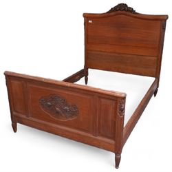 Late 19th century French oak double bedstead, headboard with shaped rail and carved pedime...