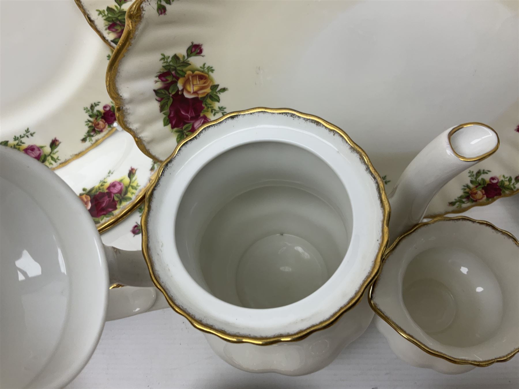 Royal Albert Old Country Roses pattern coffee set for four, comprising coffee pot, milk jug, cups and saucers, cake plate, together with six dinner plates, side plates etc (34) 