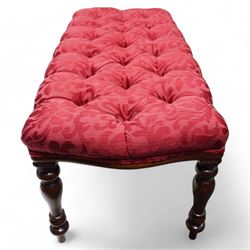 Victorian design mahogany footstool, rectangular form, the seat upholstered in red buttoned fabric with stylised foliate pattern, on turned supports 