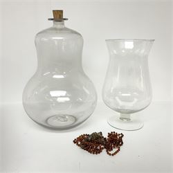 Clear glass, pear shaped carboy, with cork, together with a large footed glass vase and two necklaces, carboy H40cm
