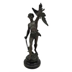 19th century French spelter figure 'Chasseur D'Aigles' on wooden base H48cm and a beaten copper circular tray inscribed with initials D61cm