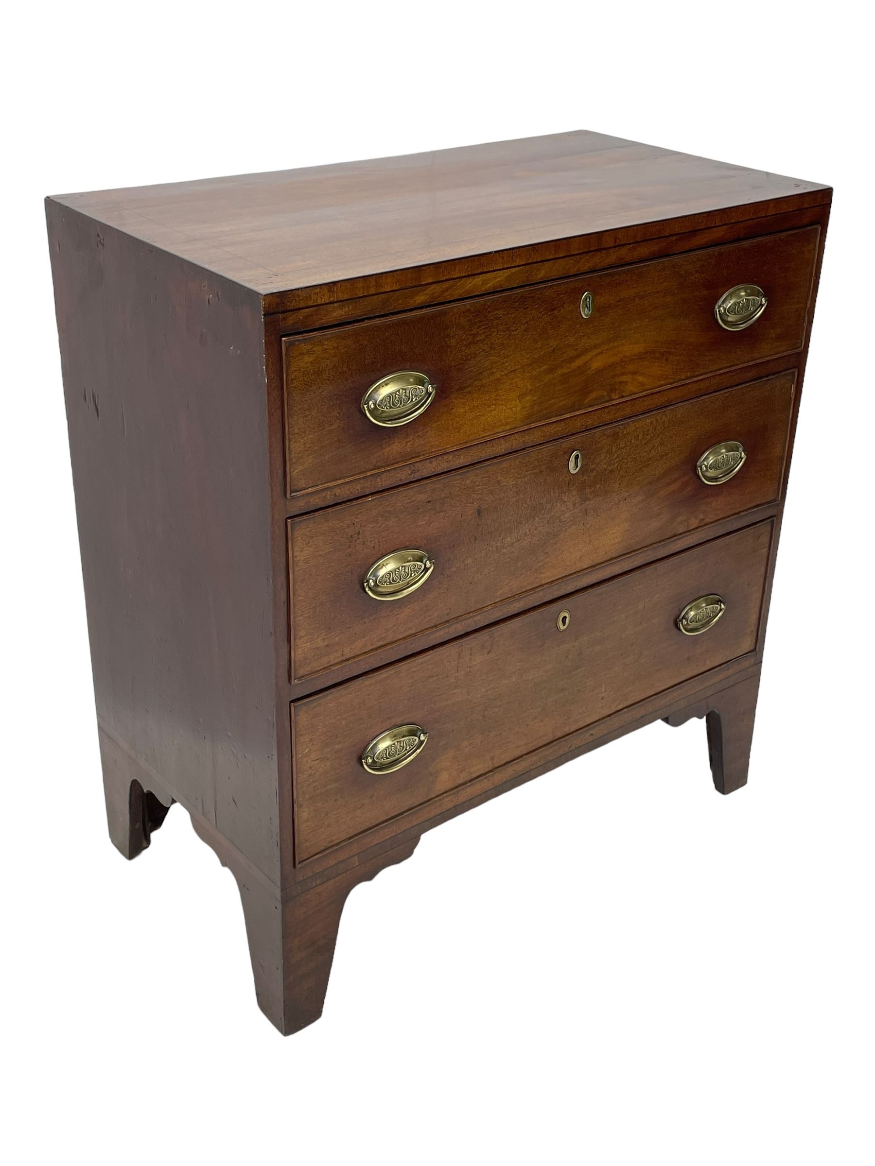 George III mahogany chest, rectangular ebony strung top, fitted with three graduating cock-beaded drawers with oval pressed brass handle plates and demi-lune handles, on tall bracket feet 