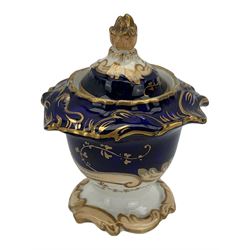 19th century porcelain inkstand, the oblong twin handled base centrally painted with a floral bouquet, flanked by two footed inkwells and covers, with rococo-inspired acanthus moulded borders and handles, pattern no. 2/3339, L26.5cm 