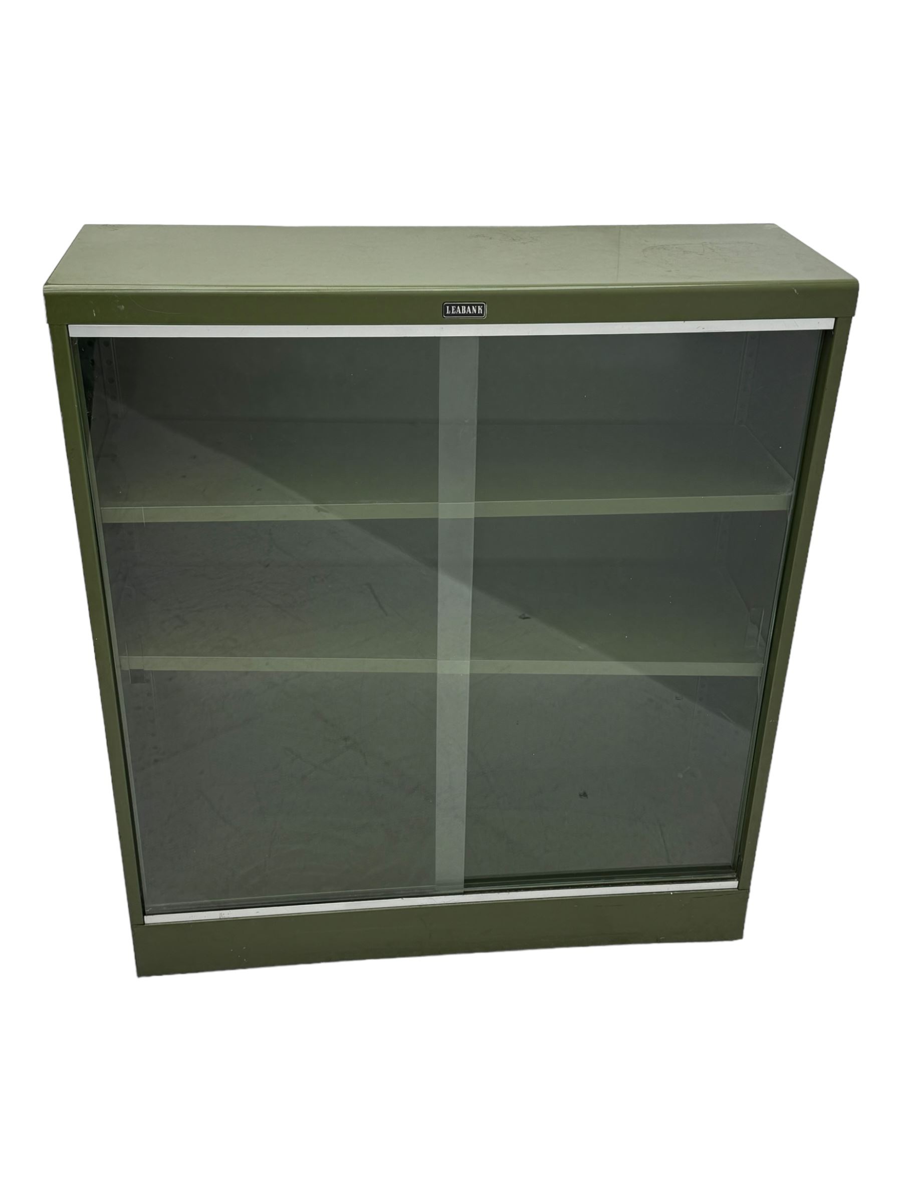 Mid-20th century 'Leabank' metal display cabinet, two sliding glass doors enclosing two adjustable metal shelves, olive green finish with chrome trim