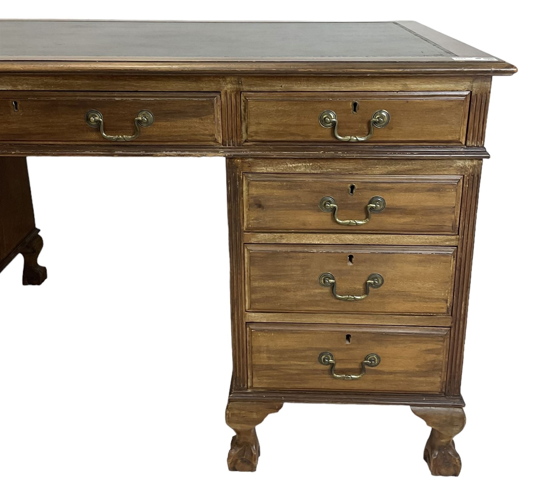 Georgian design twin pedestal desk, rectangular top with green leather inset, fitted with nine drawers, on cabriole supports with ball and claw feet 