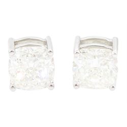 Pair of 18ct white gold cushion cut diamond stud earrings, stamped, total diamond weight, ...