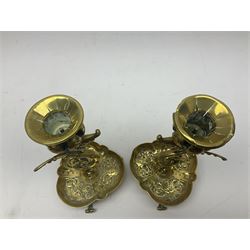 Pair of Victorian brass candlesticks by Adolf Frankau & Co, each with pierced sconce upon a scrolling stem with winged mask decoration, the lobed drip pan embossed with masks and upon three scrolling feet, stamped with maker's mark beneath, H18cm