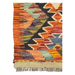 Chobi Kilim multicoloured ground runner, displaying diamond-shaped motifs in shades of blue, red, yellow, and green, accented by a bold black outline and bordered with a striped design, flatwoven with fringed edges