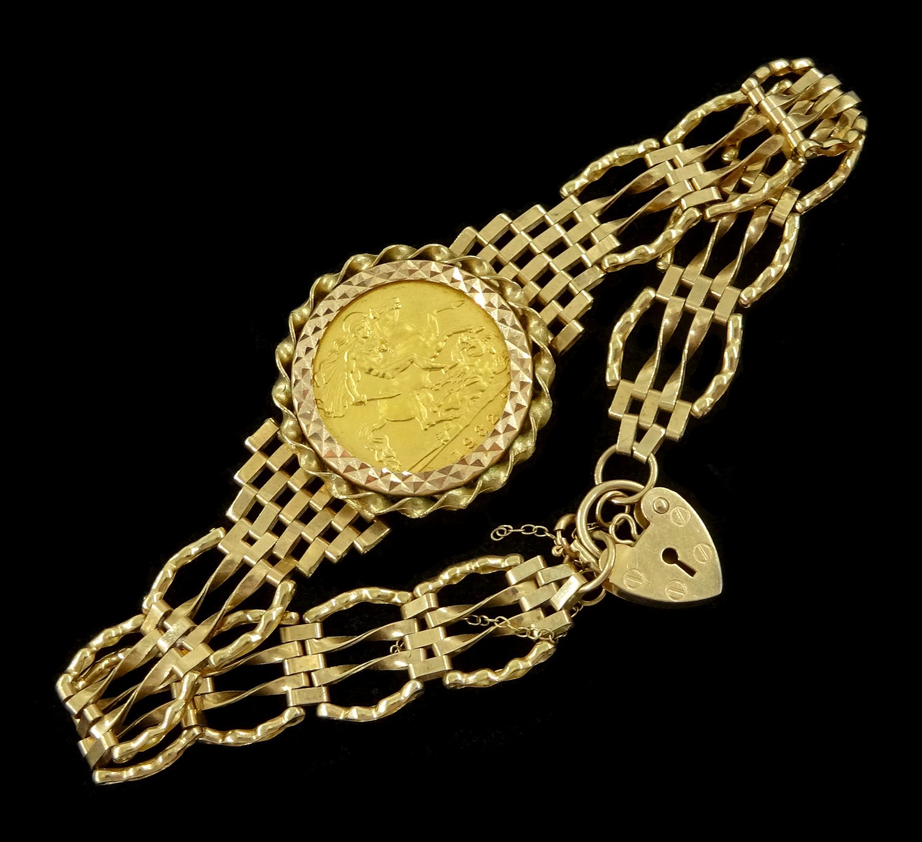 Queen Elizabeth II 1982 gold half sovereign coin, loose mounted in 9ct gold gate bracelet, with heart locket clasp, hallmarked