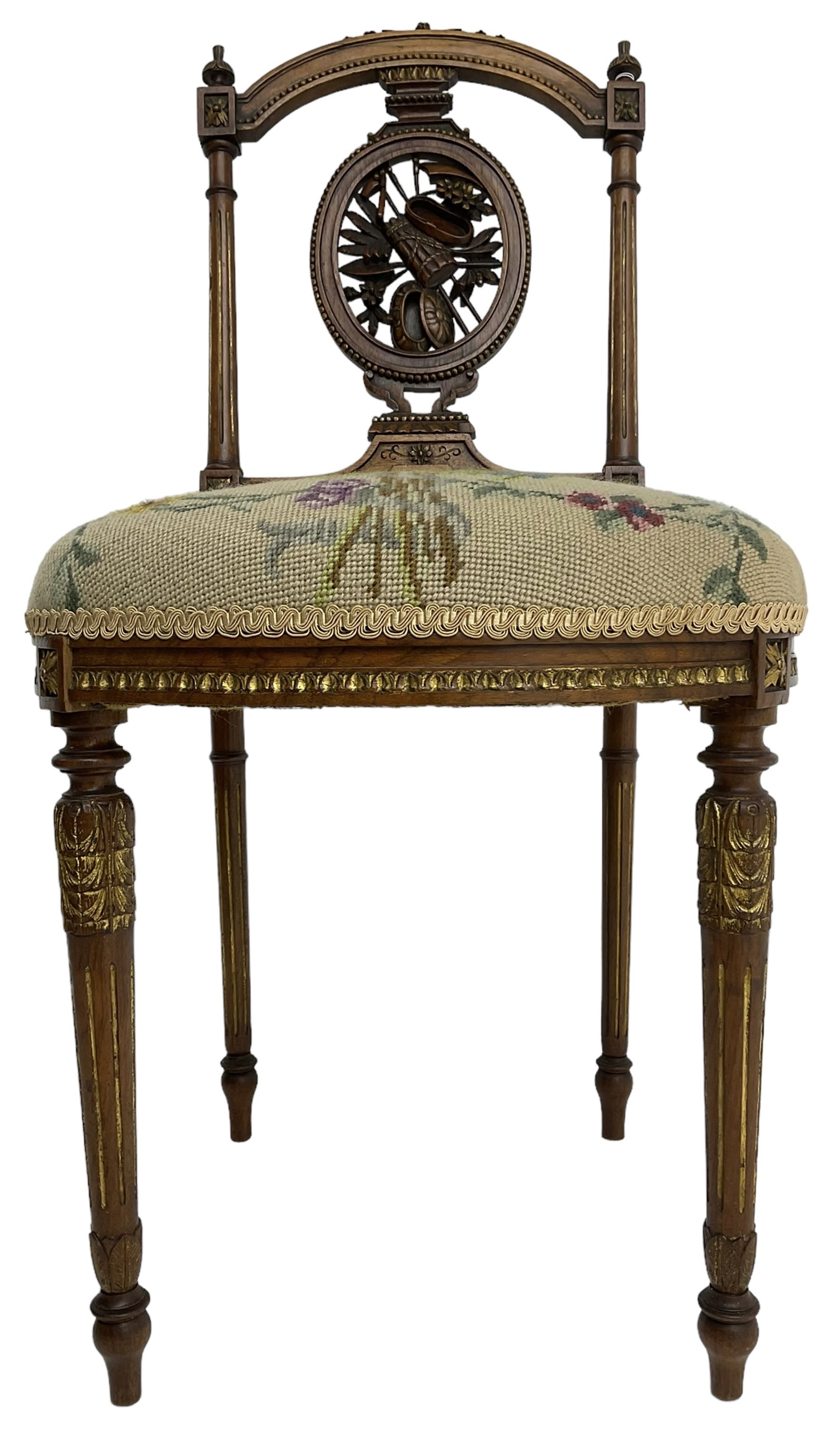 Late Victorian walnut side chair, arched cresting rail over carved and pierced splat depicting baskets and foliage, floral needle work upholstered seat, on acanthus carved and fluted turned supports