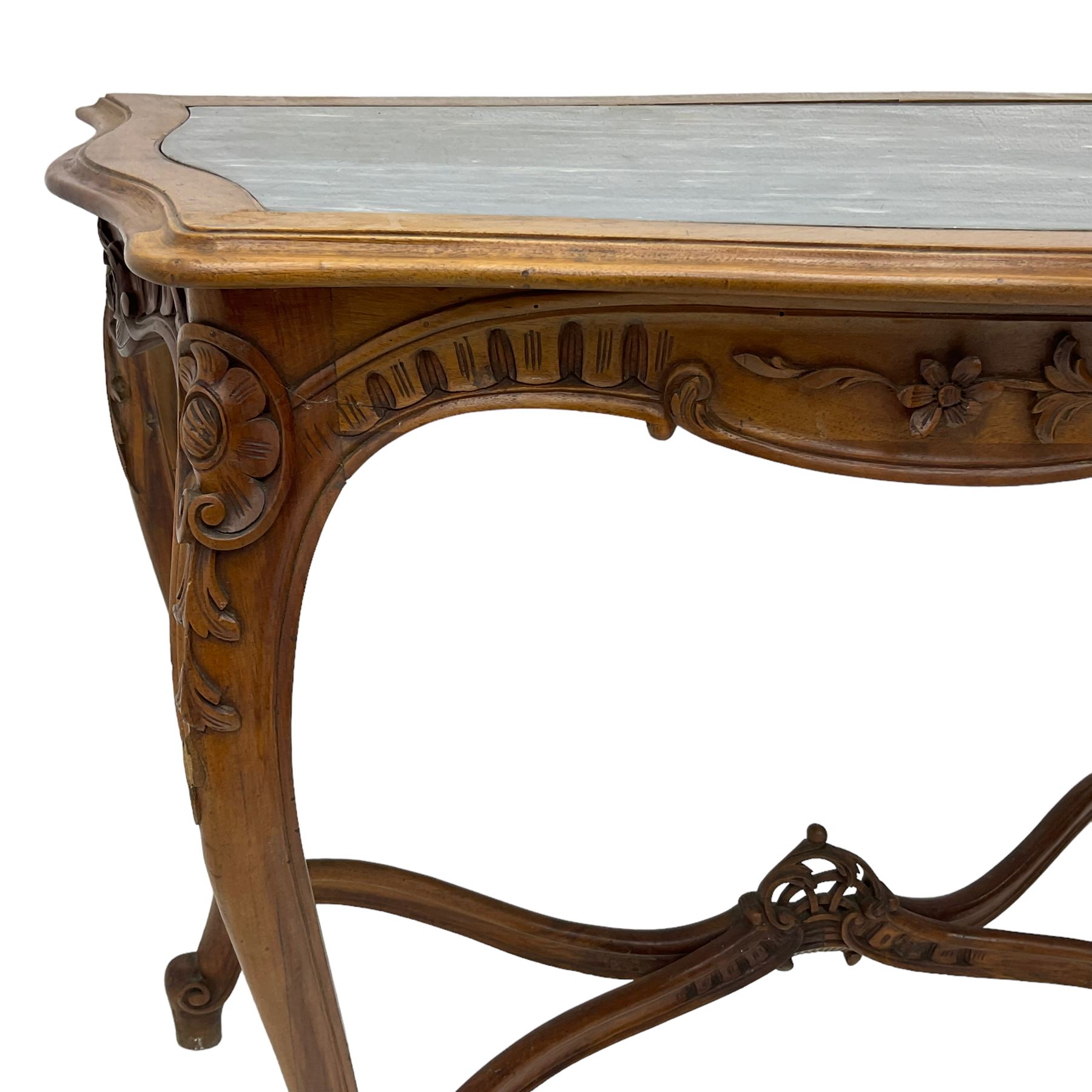 French design walnut console table, shaped top with inset grey marble panel, the frieze pierced and carved with scrolling foliage and applied flower heads, raised on cabriole supports with cartouche carved knees, united by shaped X-stretcher