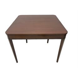 Early 20th century mahogany tea table, fold-over swivel top with rounded corners, raised on square tapering supports