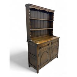 Jacobean design oak dresser, raised back with three fixed shelves above a rectangular top ...