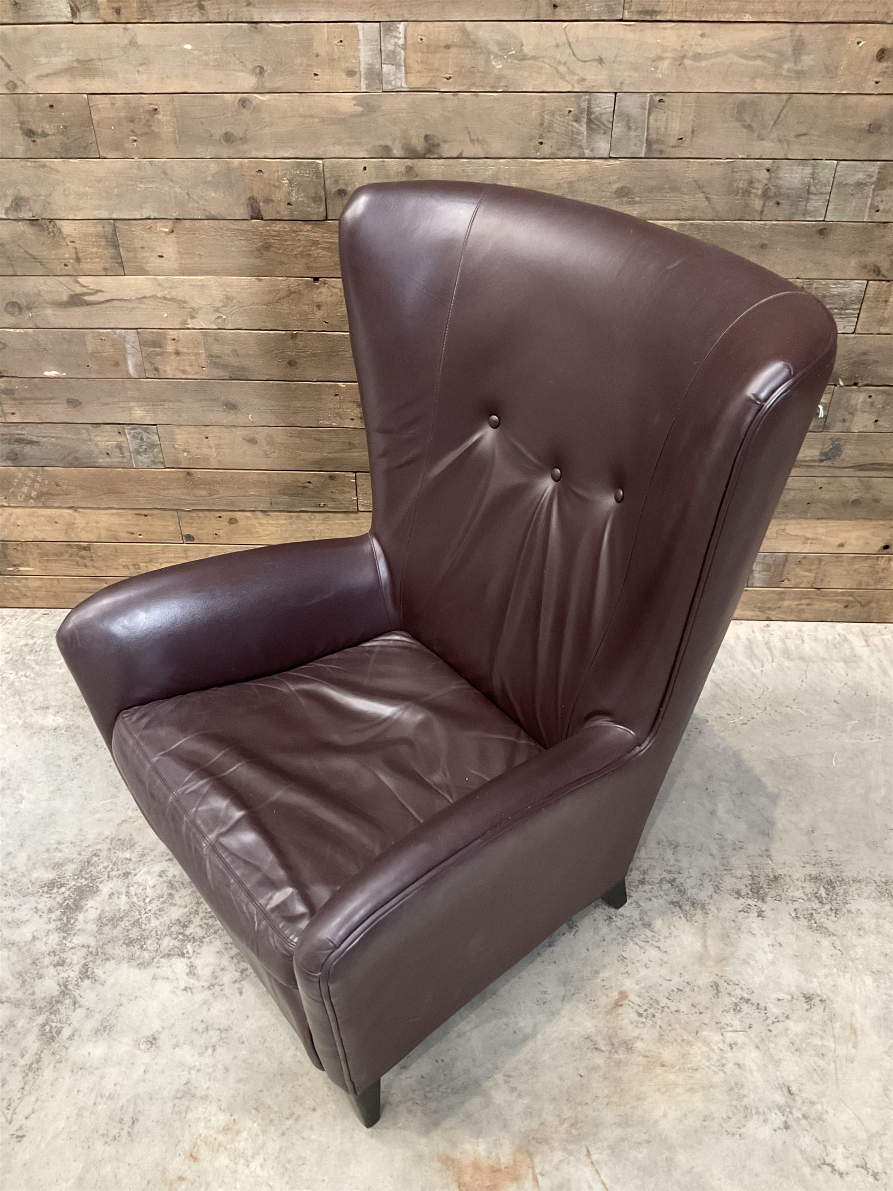 Wing back armchair upholstered in cocoa brown leather