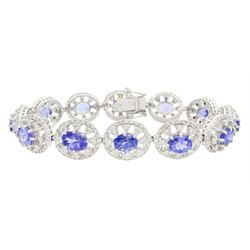 18ct white gold tanzanite and diamond bracelet, twelve oval link clusters set with oval cut tanzanite's and round brilliant cut diamonds, stamped 750, total tanzanite weight approx 11.00 carat, total diamond weight approx 3.65 carat