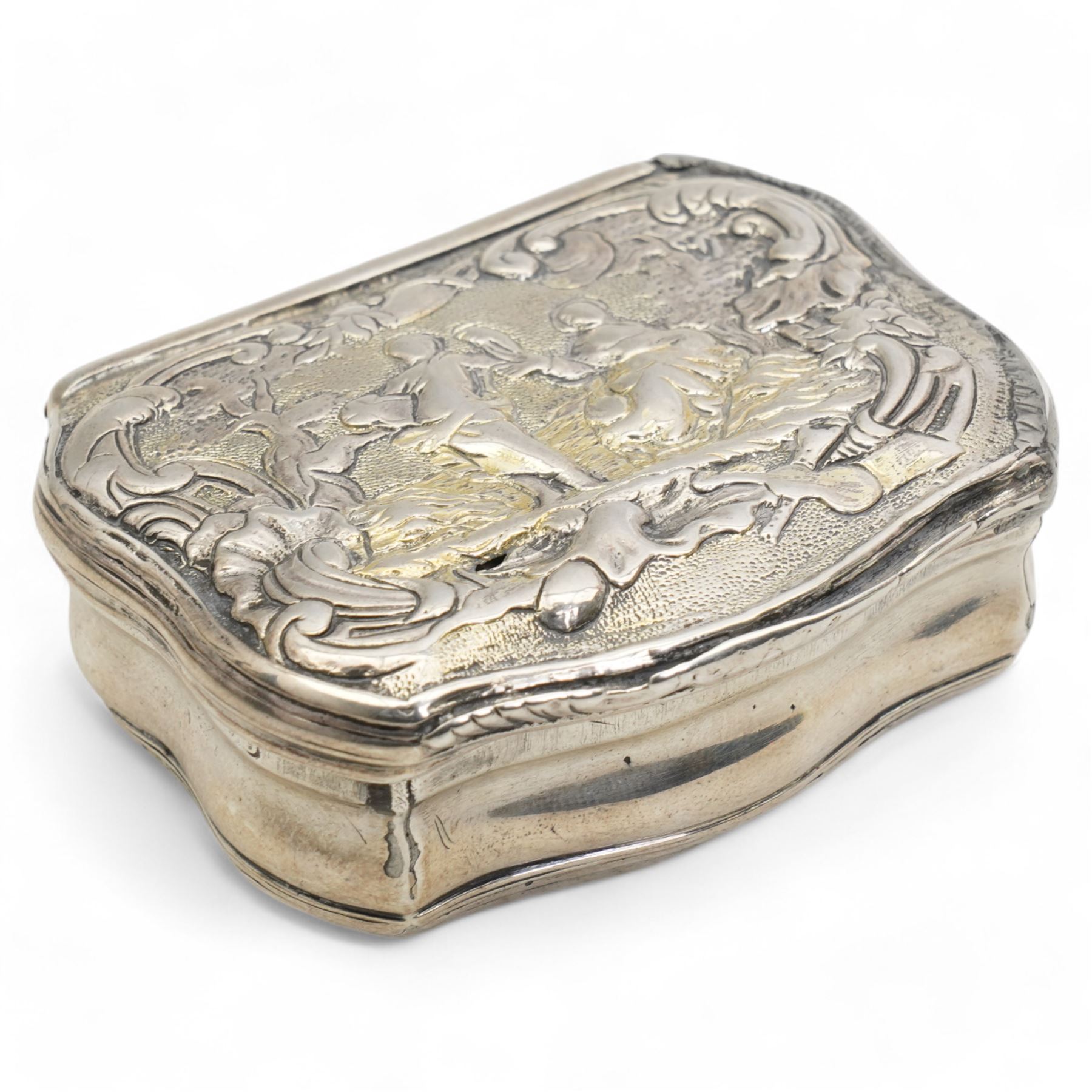 18th century Swedish silver snuff box of serpentine outline, the hinged cover with embossed classical figures, the base engraved 'Anno 1750' and with initials W7cm