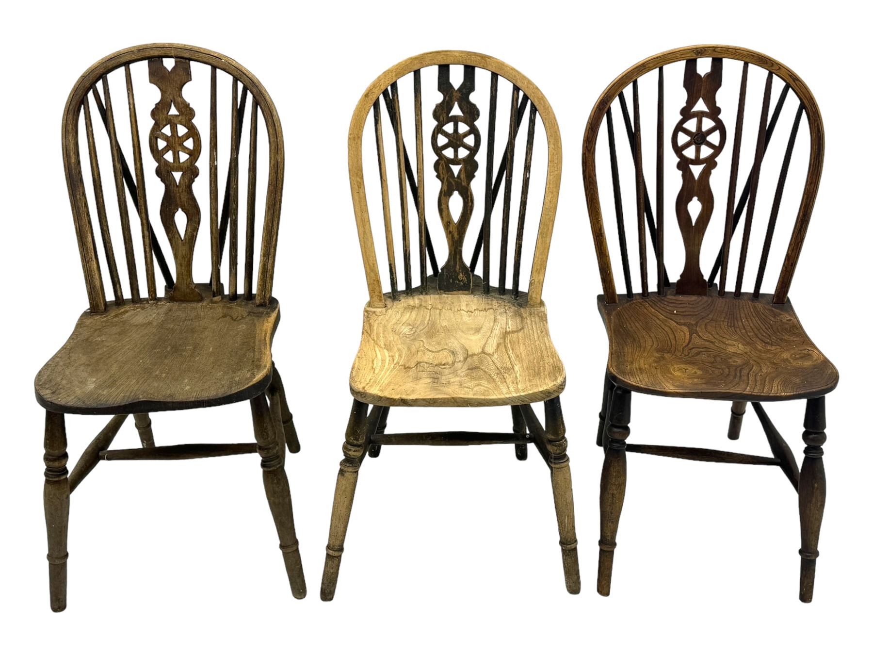 Mid-to-late 20th century set of six elm and beech Windsor dining chairs, hoop and stick back with pierced wheel splat, dished elm seat, on turned supports united by turned stretchers 