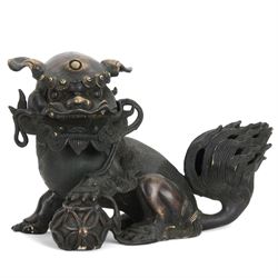 Bronze dog of foo, modelled with one paw placed upon ball, H18cm