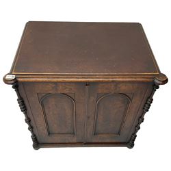 Victorian lacquered mahogany cupboard, fitted with two arch panelled doors enclosing two shelves, flanked by split turned uprights