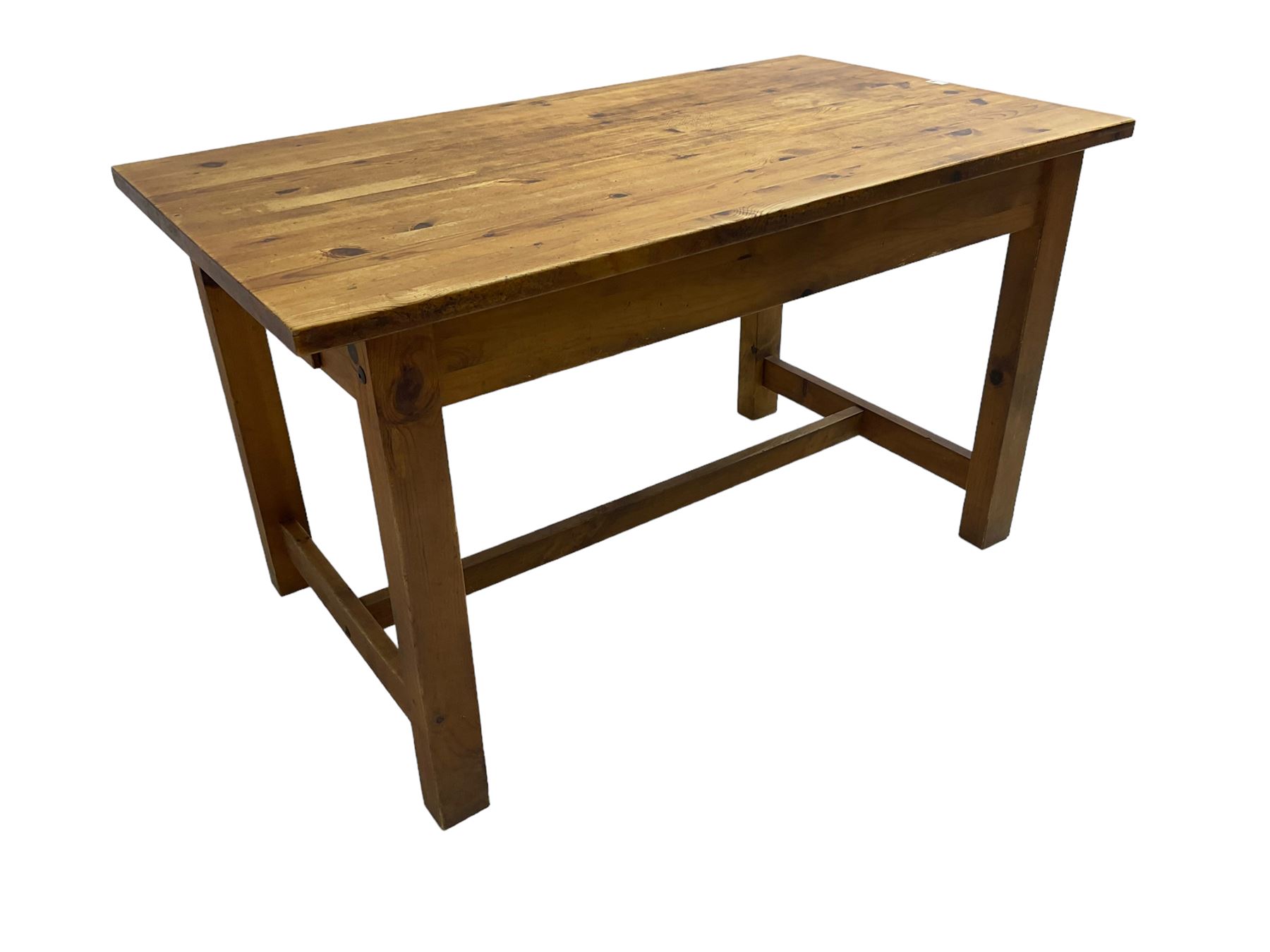 Traditional waxed pine kitchen or dining table, rectangular top over square supports united by H-stretcher