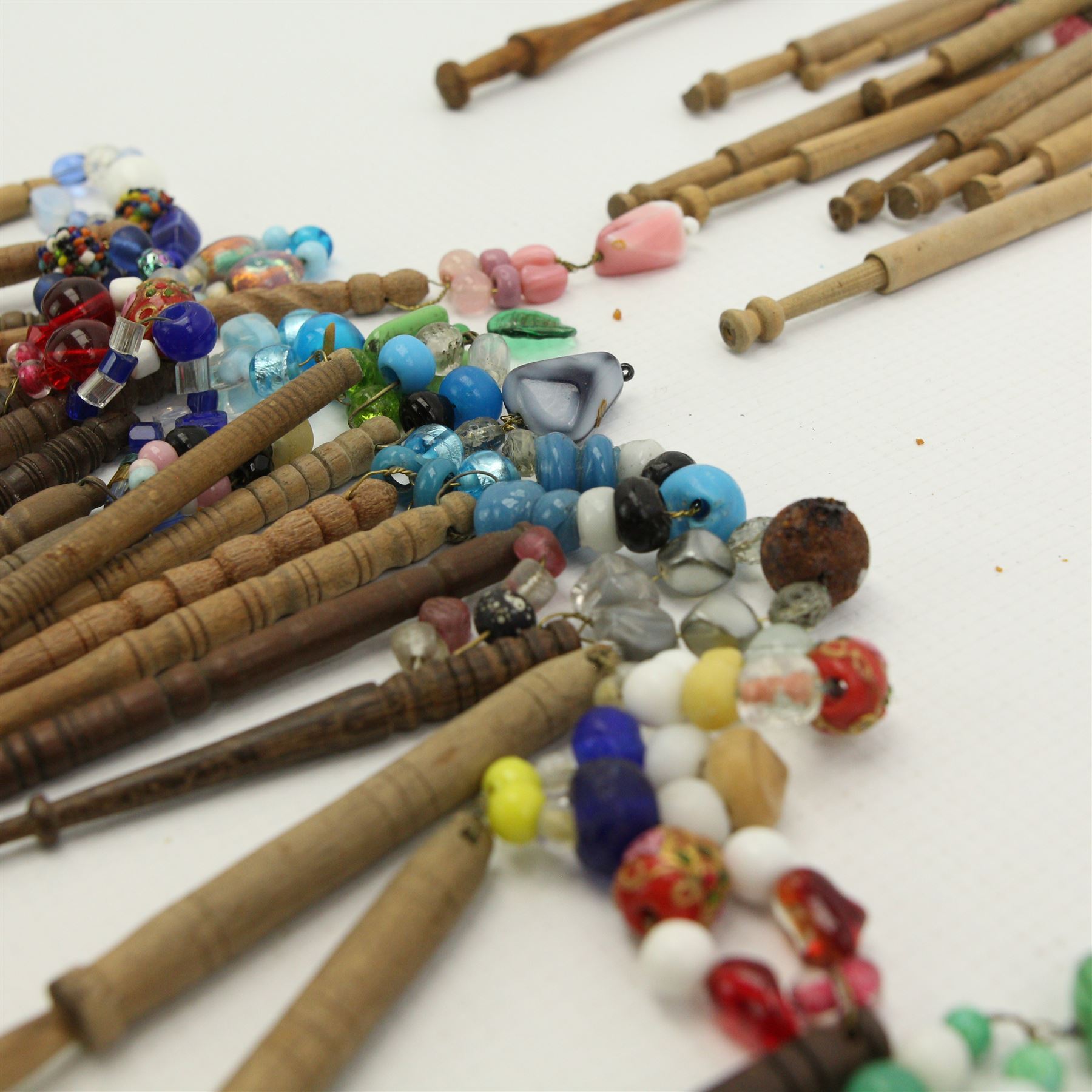 Collection of turned wooden lace maker's bobbins, including 19th century and later examples, mostly with glass spangles and turned shafts (100 approx)