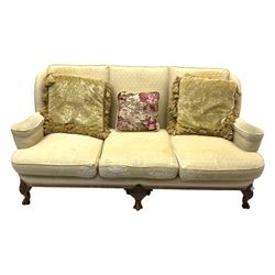 Late 20th century mahogany framed three seat sofa, upholstered in cream fabric with repeating cross pattern, raised on cabriole supports (W192cm, D98cm, H89cm); matching armchair in light pink fabric (W92cm, D98cm, H89cm) 