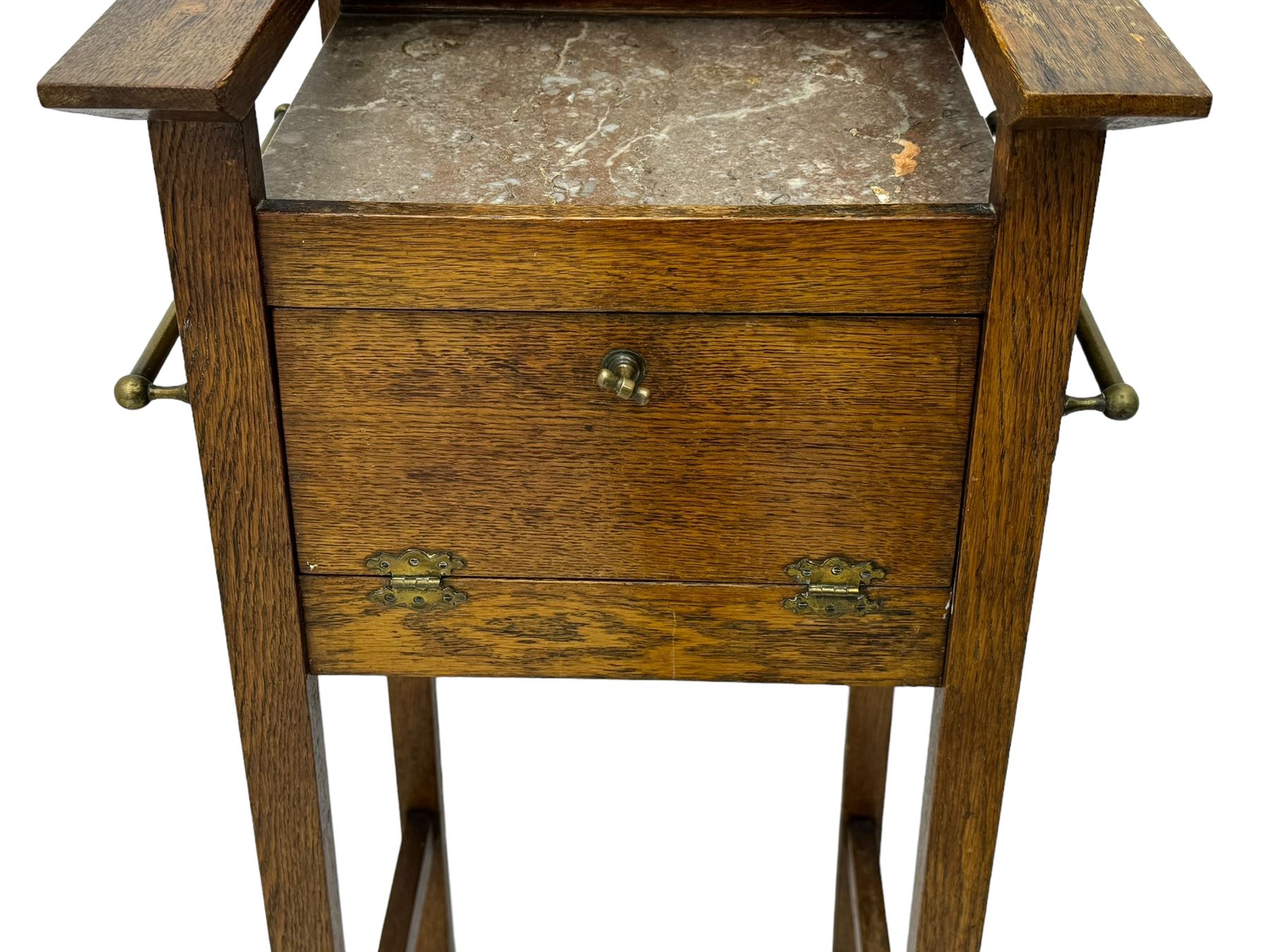 Early 20th century oak vanity stand, with circular adjustable mirror, brass towel rails to the sides, marble inset top and upper compartment, over additional storage compartment with hinged front, on splayed supports with stretchers