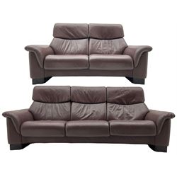 Ekornes Stressless - three-seat sofa upholstered in chocolate brown leather, with high backrests, cushioned headrests, and manual reclining mechanism (L248cm, D84cm, H102cm); with matching two-seat sofa (L184cm, D84cm, H102cm)