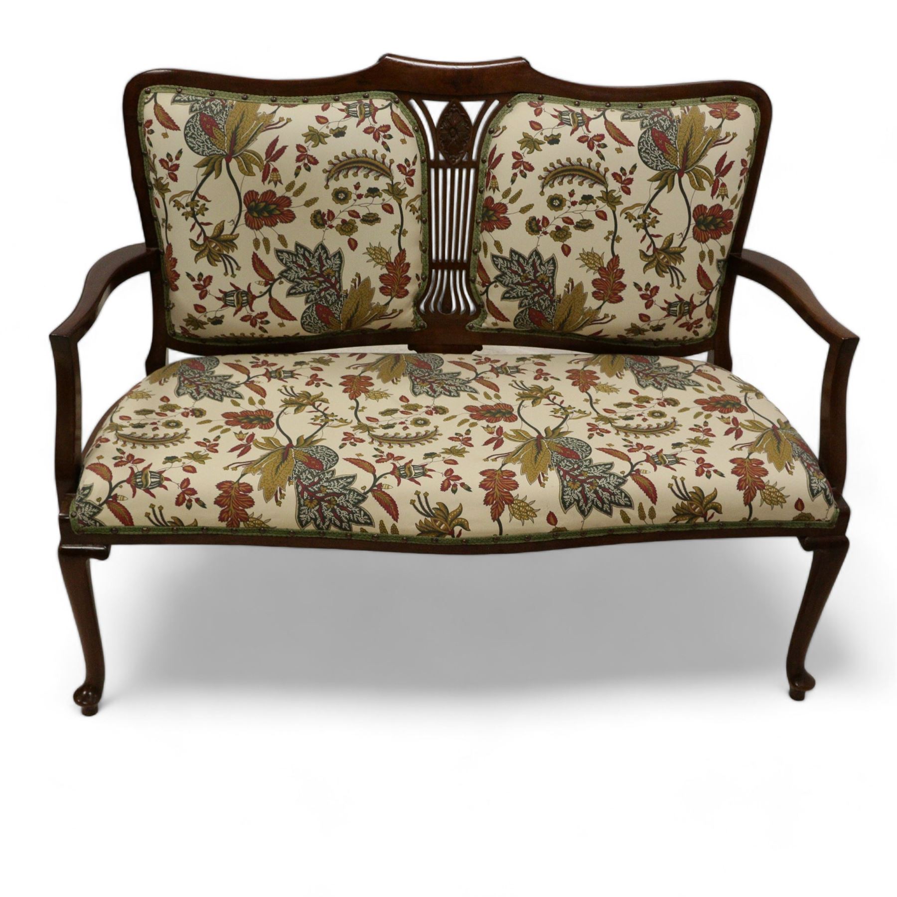 Edwardian mahogany framed two seat settee, upholstered in cream foliate fabric