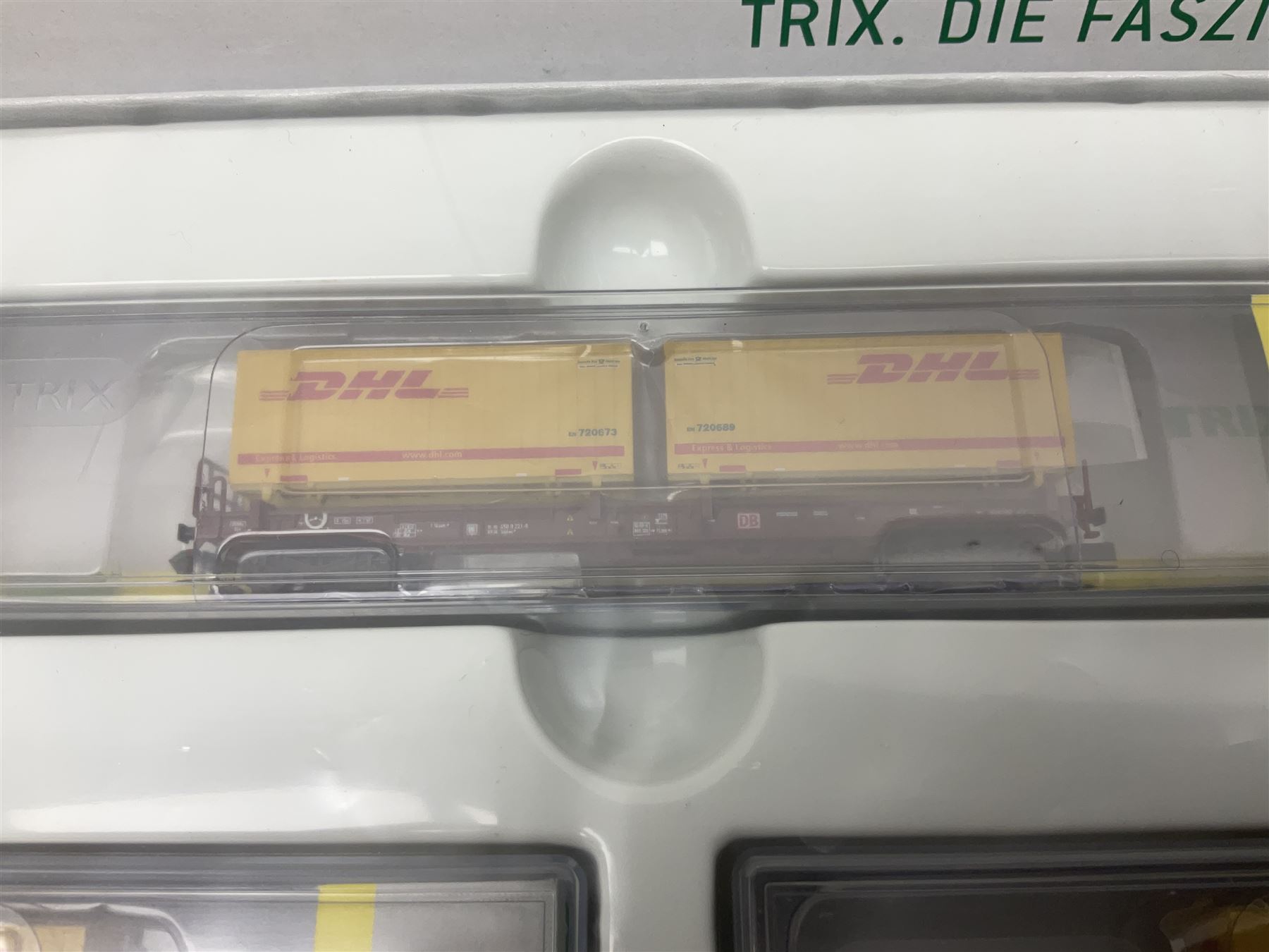 Trix Minitrix 'N' gauge - No.15272 DHL five-car set; boxed; and No.13982 set of three Cargo goods wagons; boxed (2)