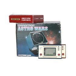 Three 1980s Nintendo Game & Watch handheld electronic games, to include a boxed Multi Screen Mario Bros example and two unboxed single screen examples Parachute and Fire, together with a Grandstand Astro Wars electronic game, boxed with instructions