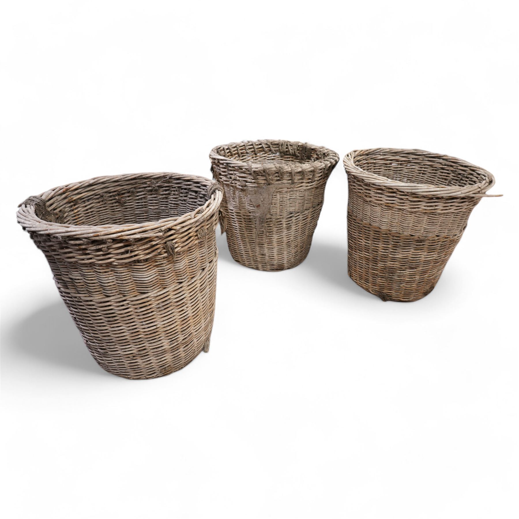 Six large wicker cargo baskets, circular tapering form, the largest height - 81cm