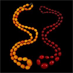 Single strand graduated oval amber bead necklace and a cherry amber type bead necklace